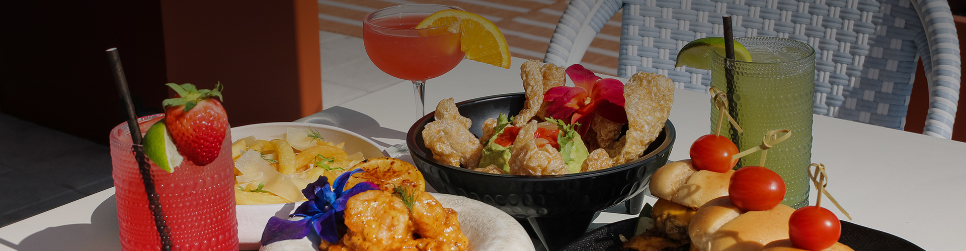 a bowl of food next to a drink