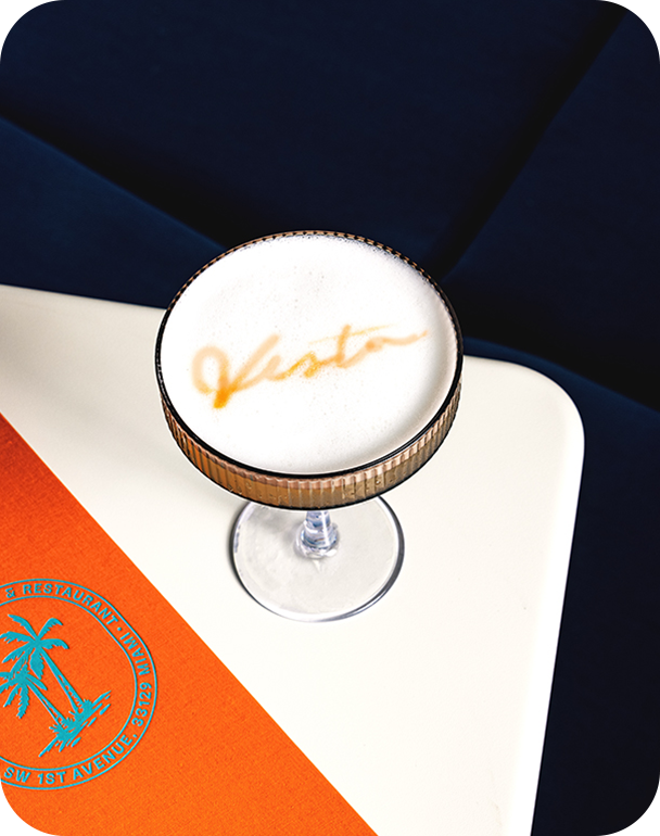 a glass with a drink in it