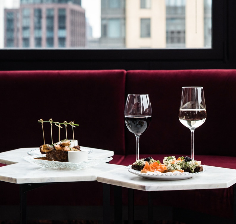 a table with food and wine glasses on it