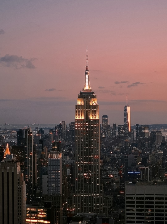 a city skyline with a tall building