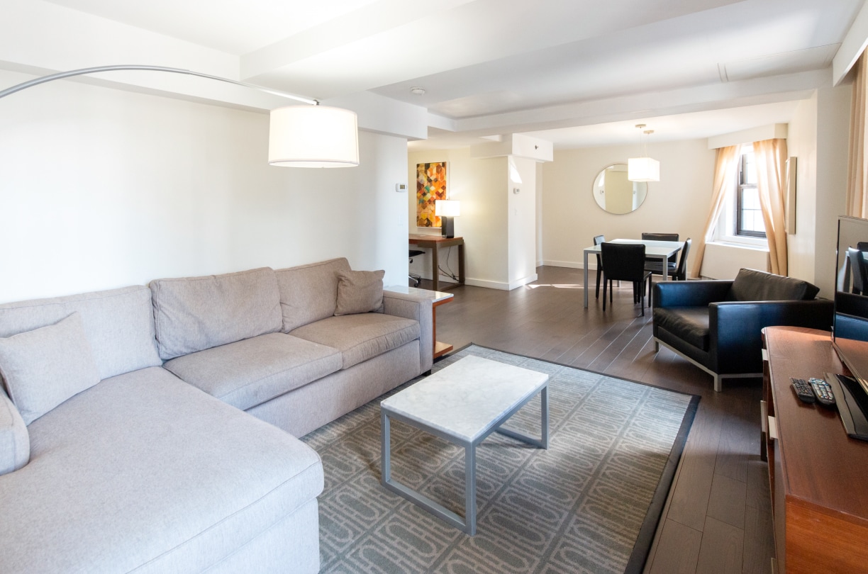 a living room with couches and chairs
