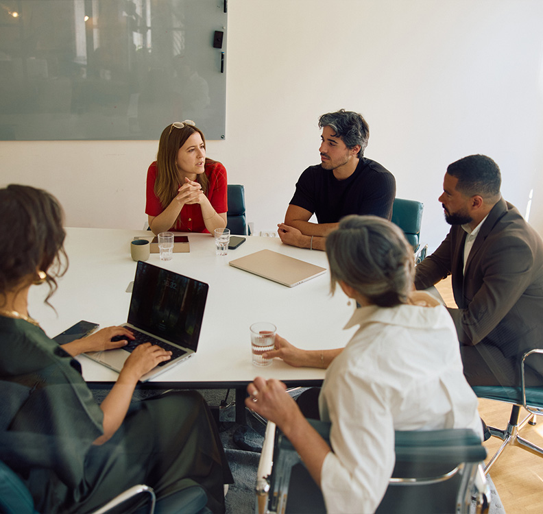 a group of people sitting around a table