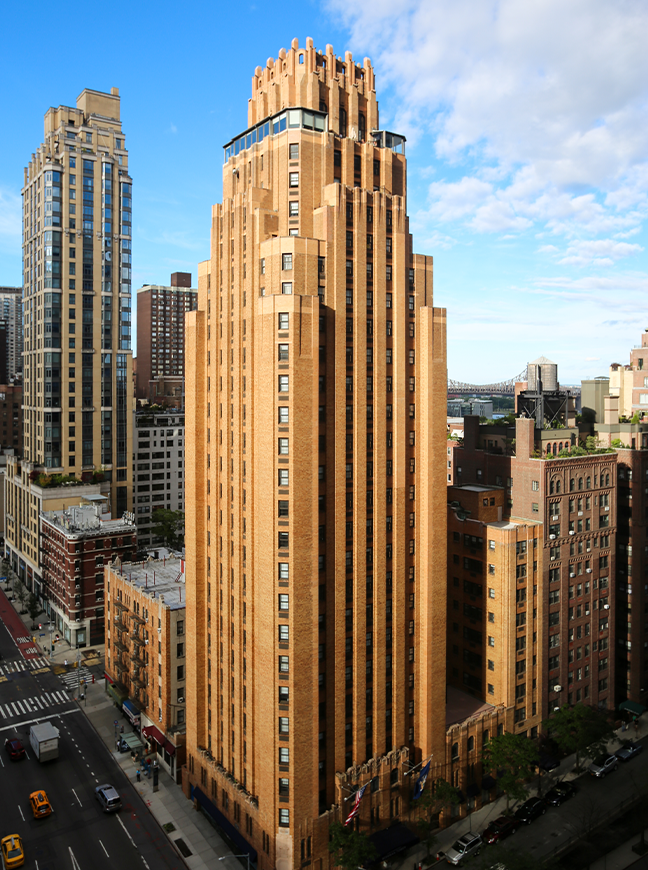 a tall building with many windows with Tribune Tower in the background