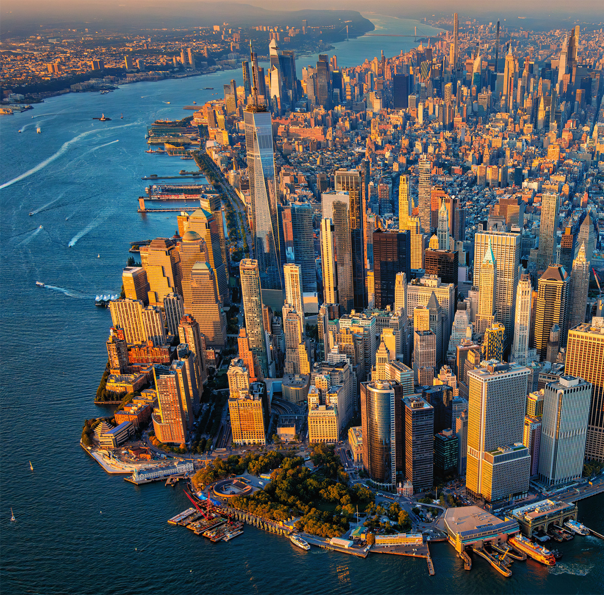 a city with many tall buildings and a body of water