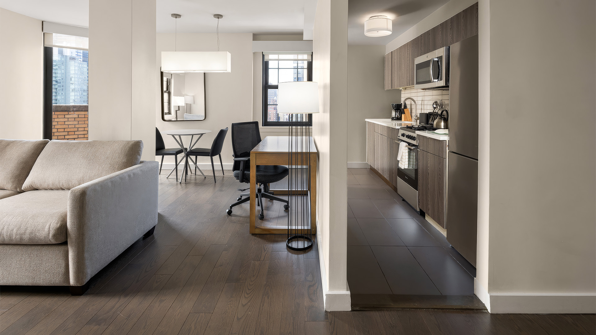 a living room with a kitchen and dining area