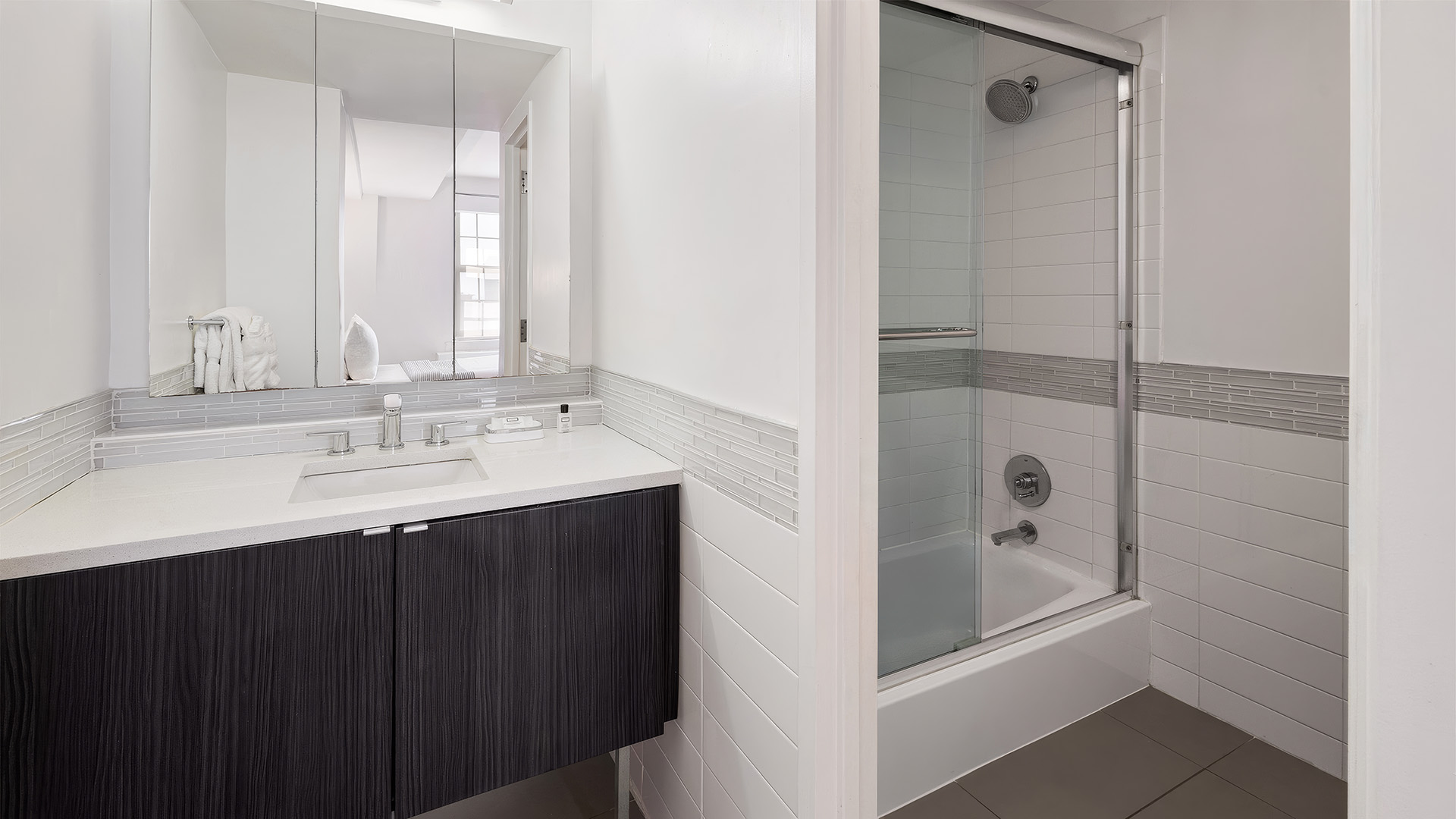 a bathroom with a shower and sink