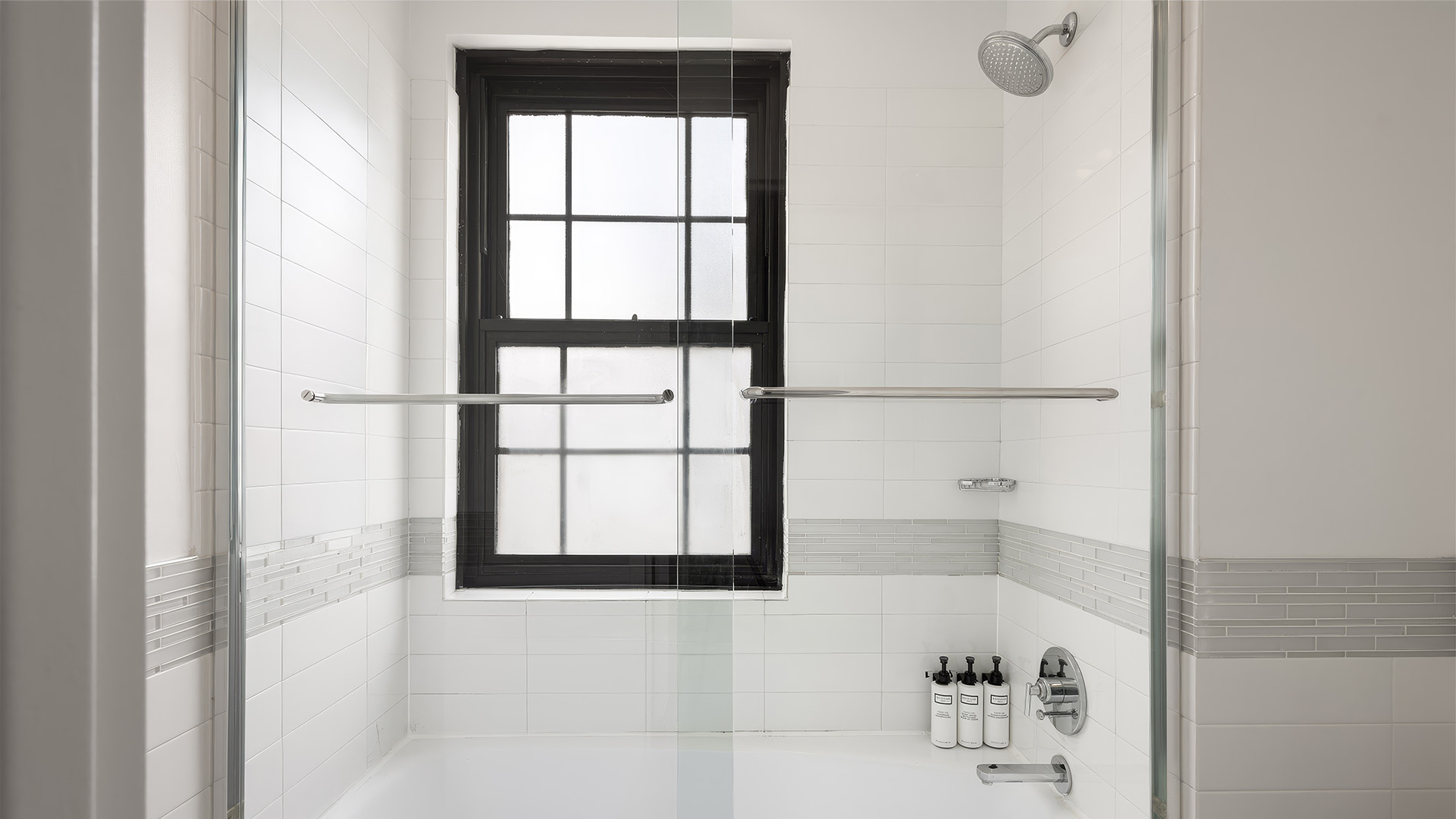 a bathroom with a window and shower