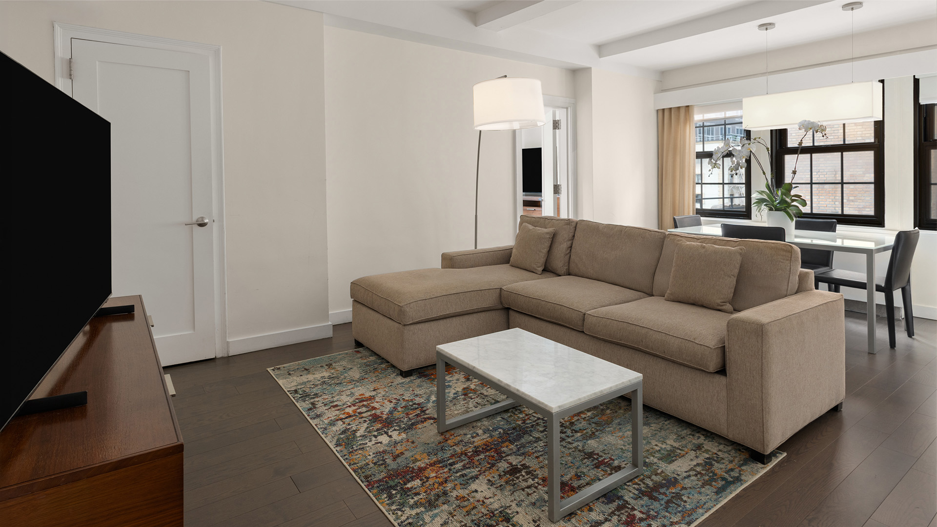 a living room with a couch and a table