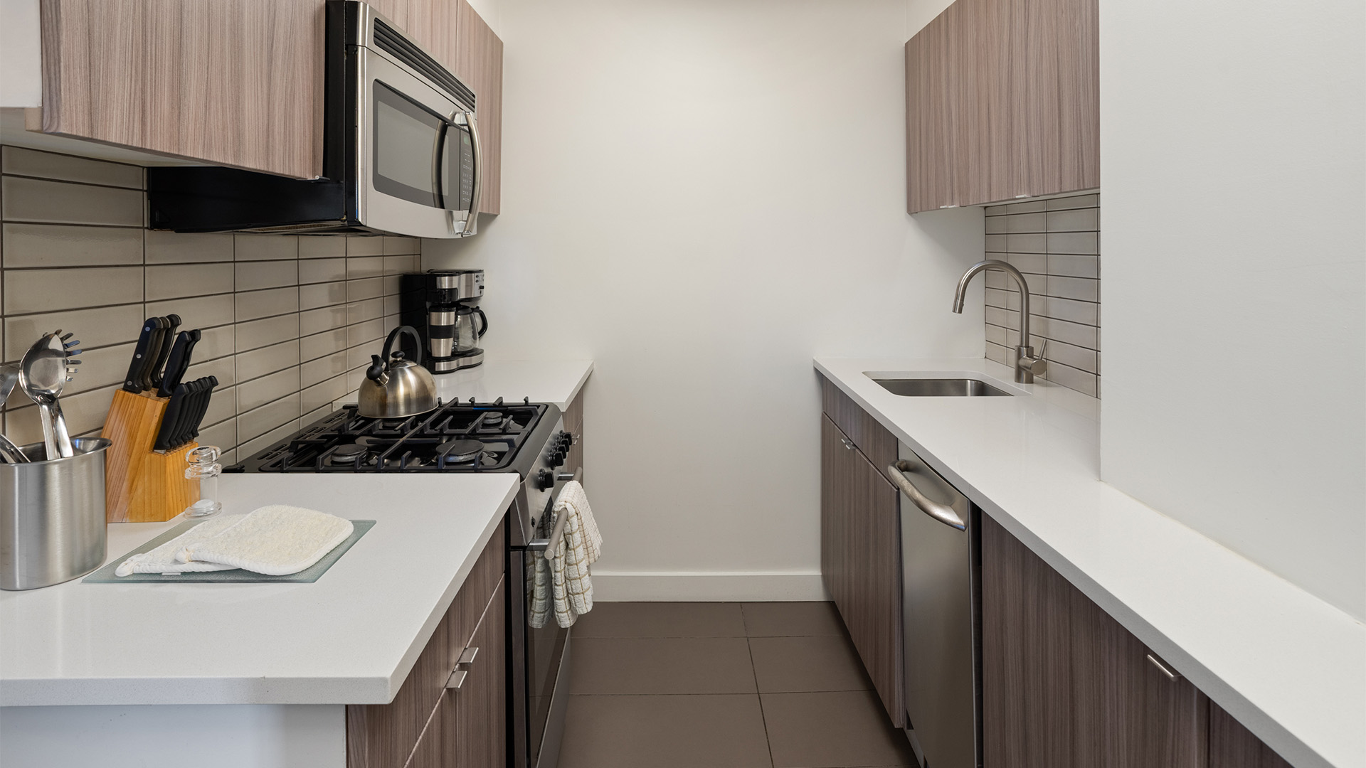 a kitchen with a microwave and oven