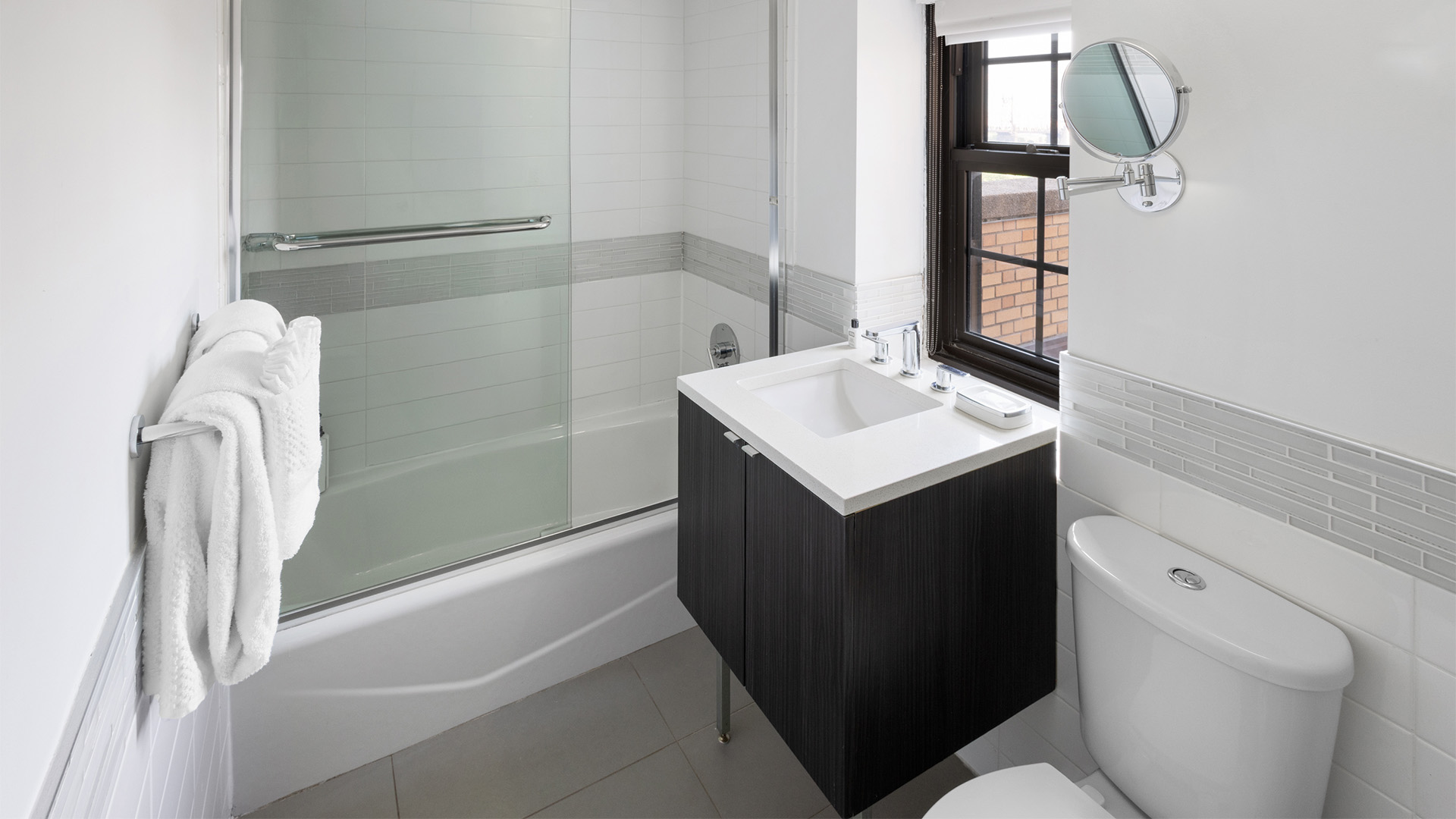 a bathroom with a shower and sink