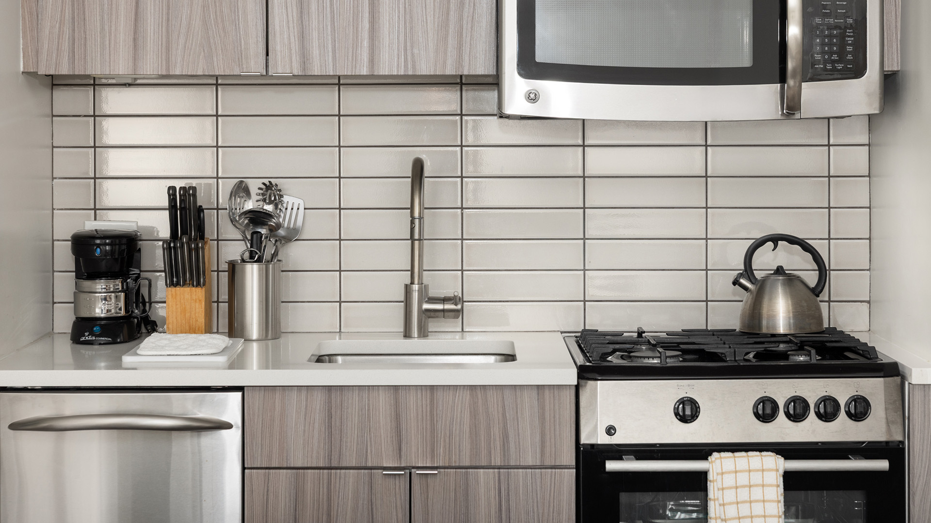 a kitchen with a sink and stove