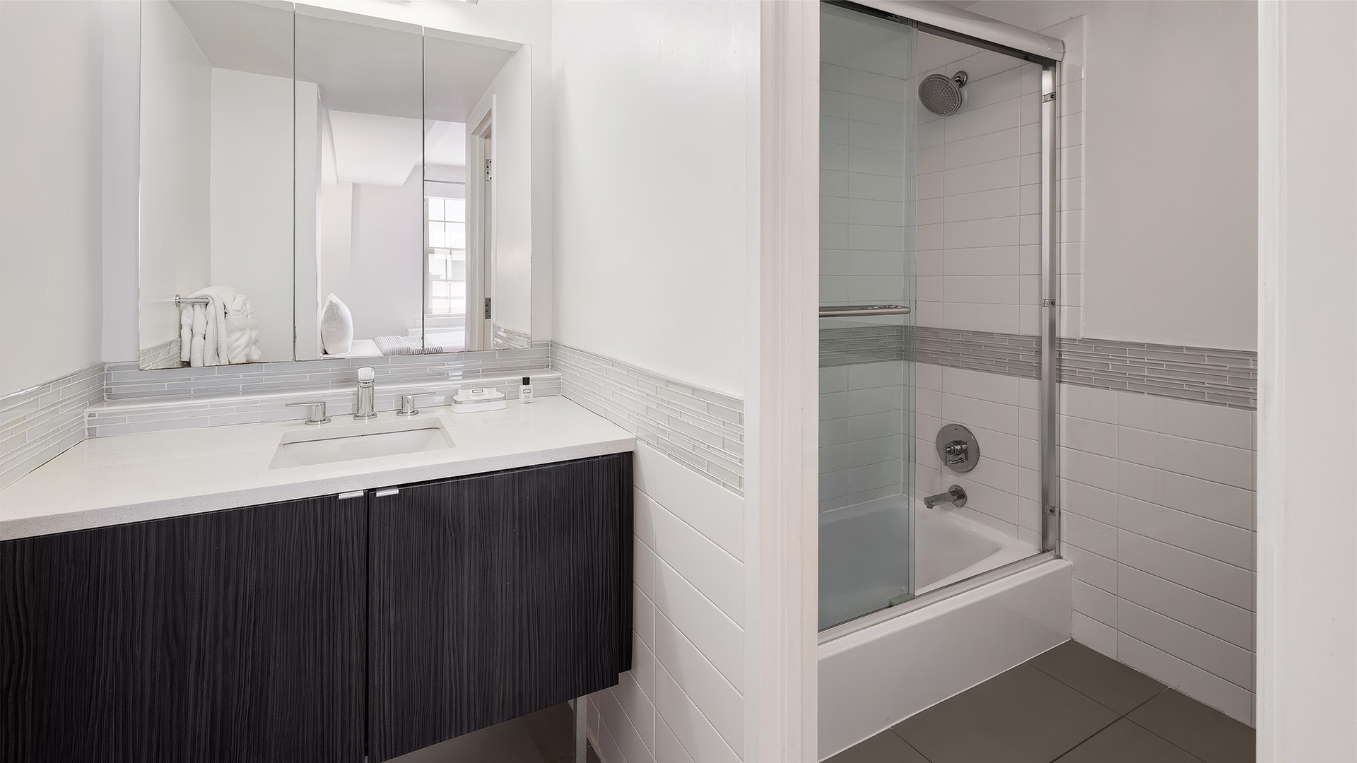 a bathroom with a shower and sink