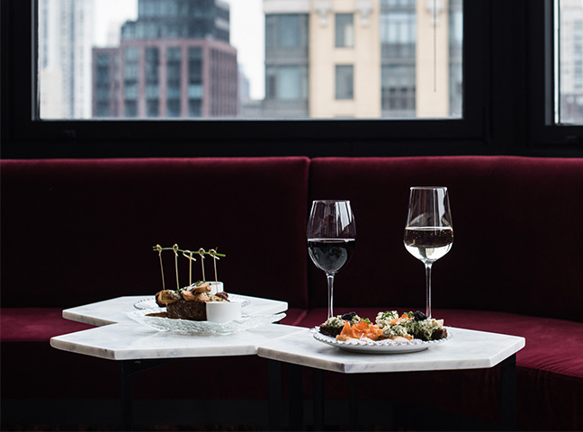 a table with food and wine glasses on it