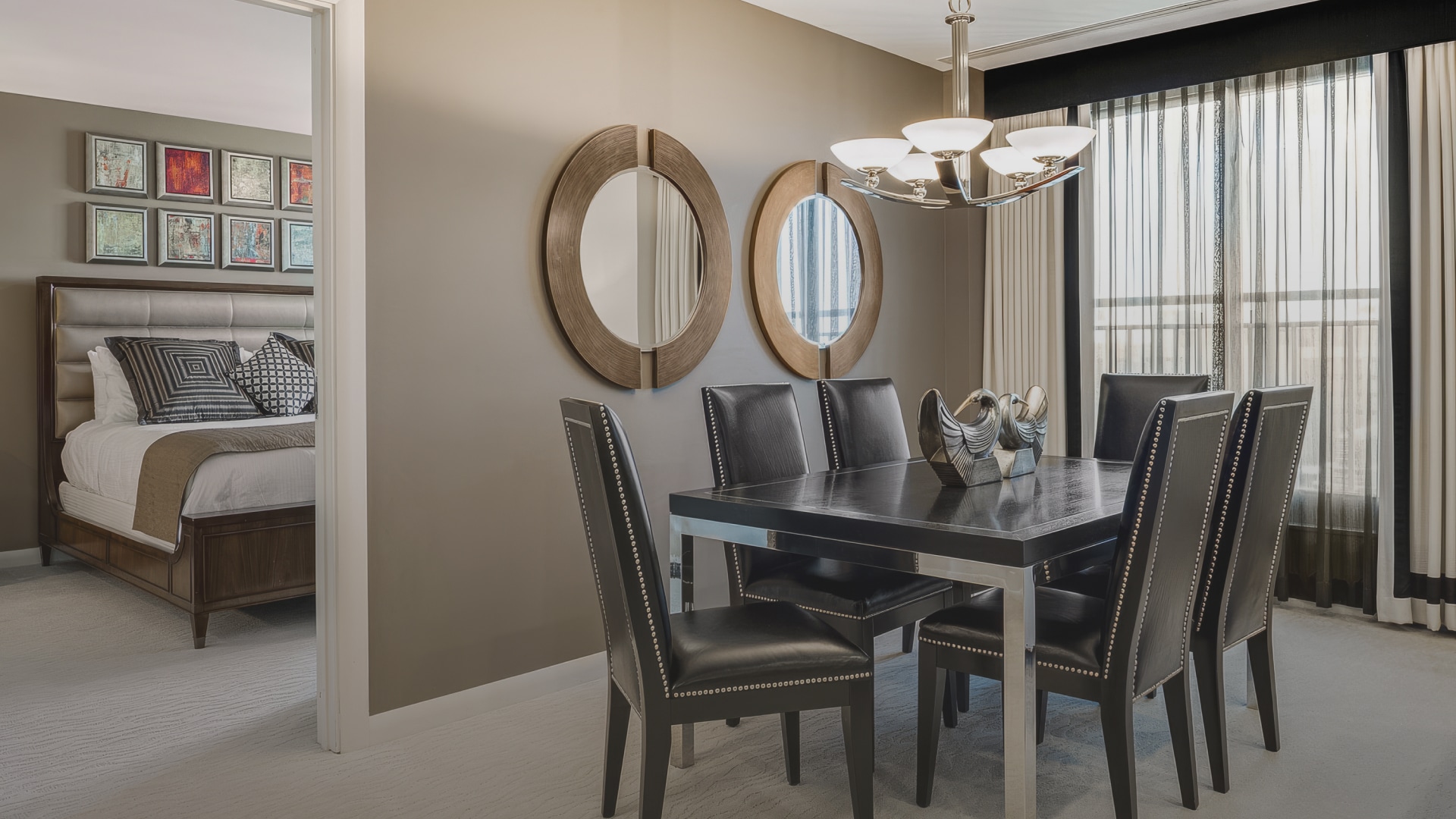a dining table with chairs in a room