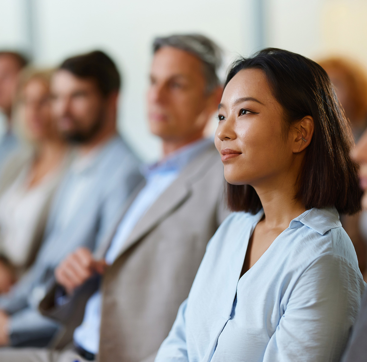 a woman sitting in a row
