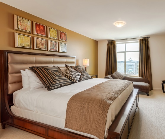 a bedroom with a bed and a window