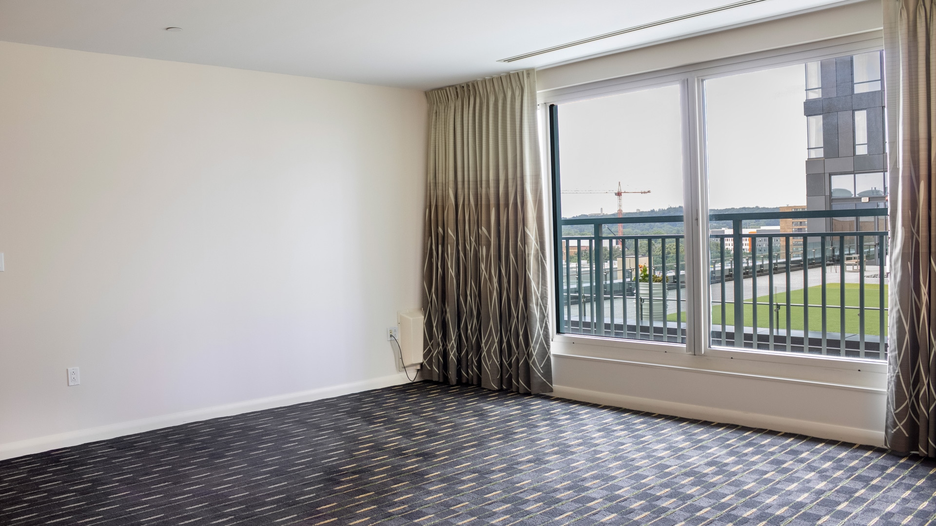 a room with a window and a balcony