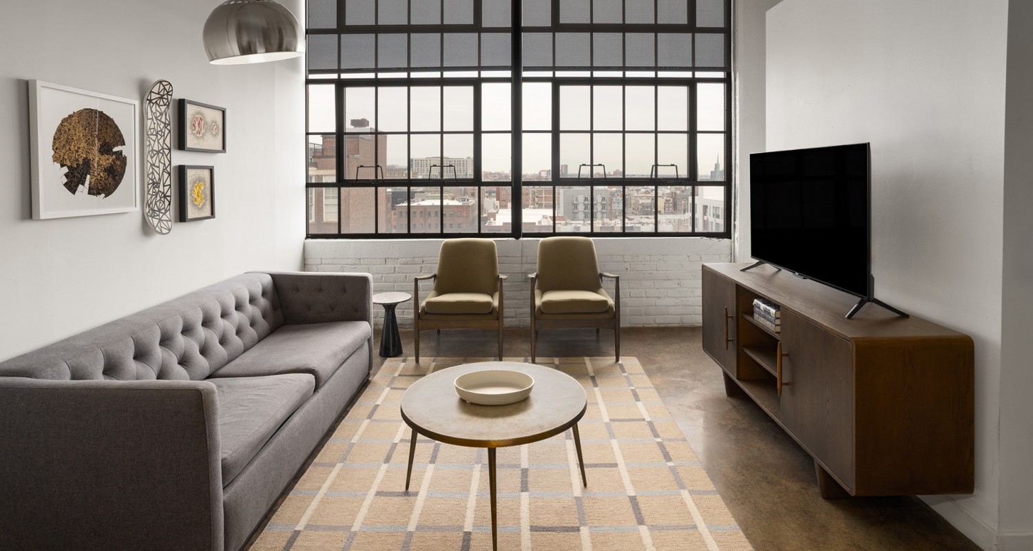 a living room with a couch and a table