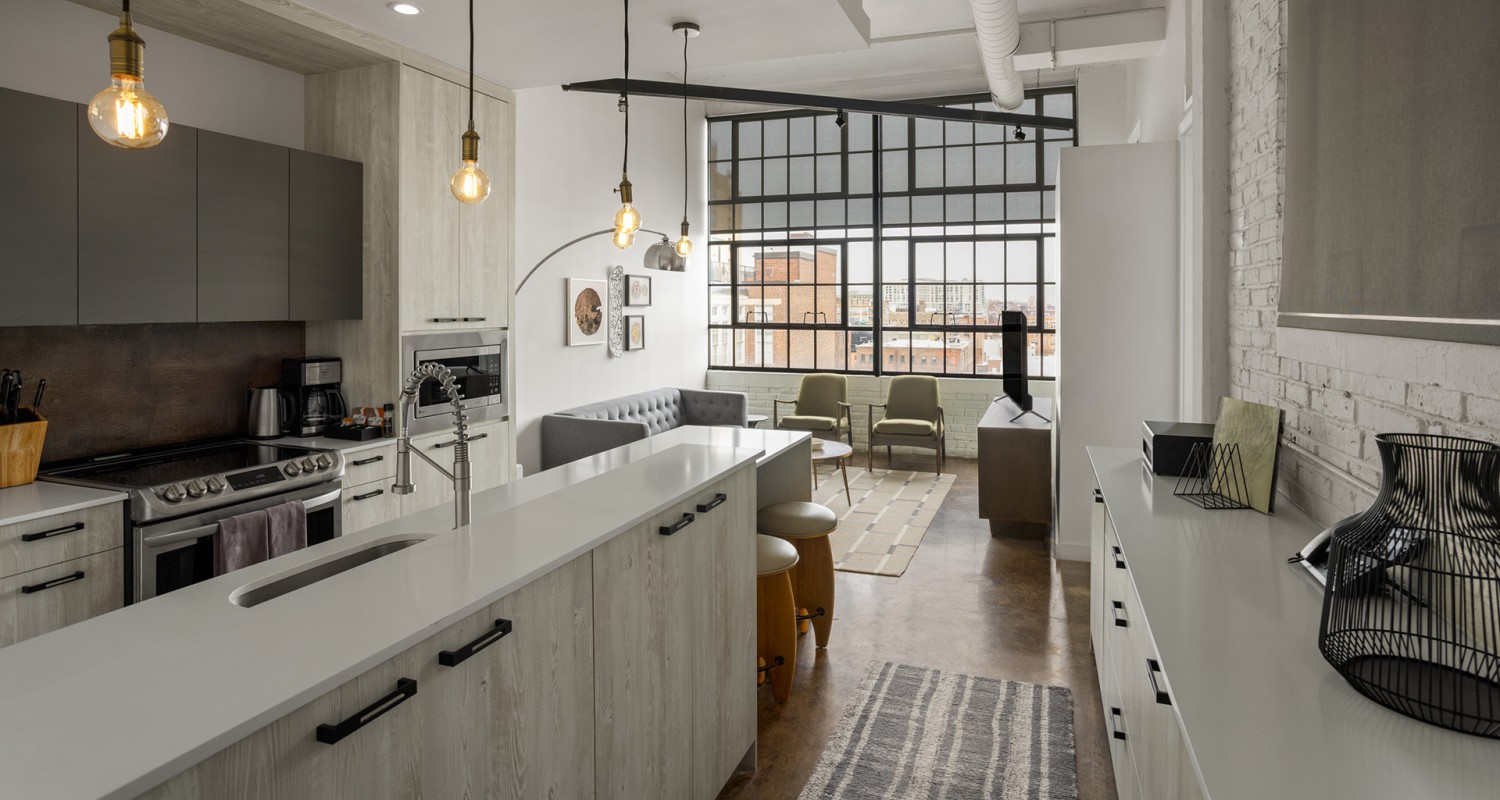 a kitchen with a couch and chairs