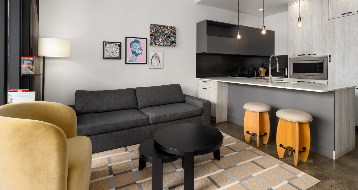 a living room with a couch and a rug