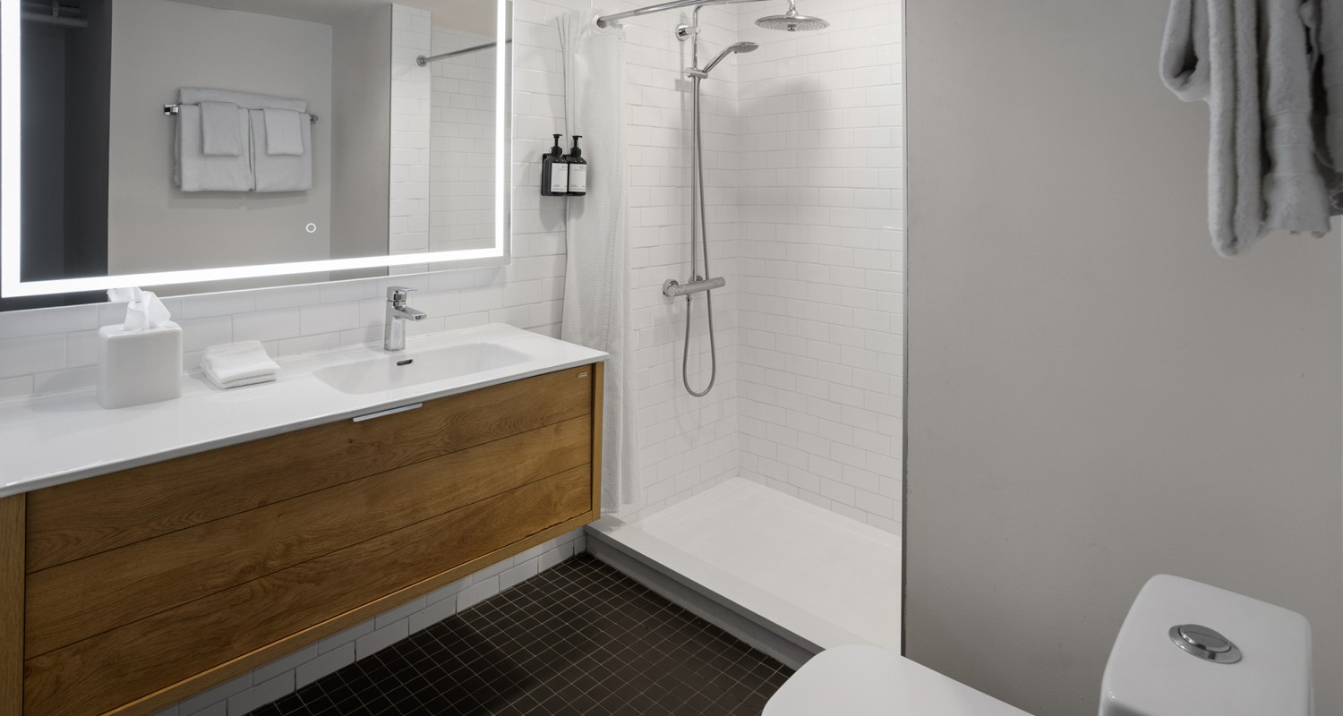 a bathroom with a shower and sink