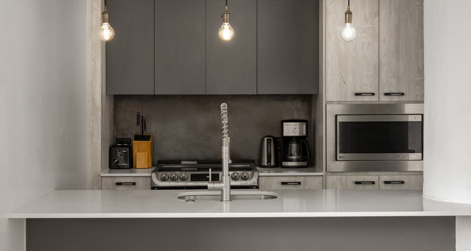 a kitchen with a sink and a microwave