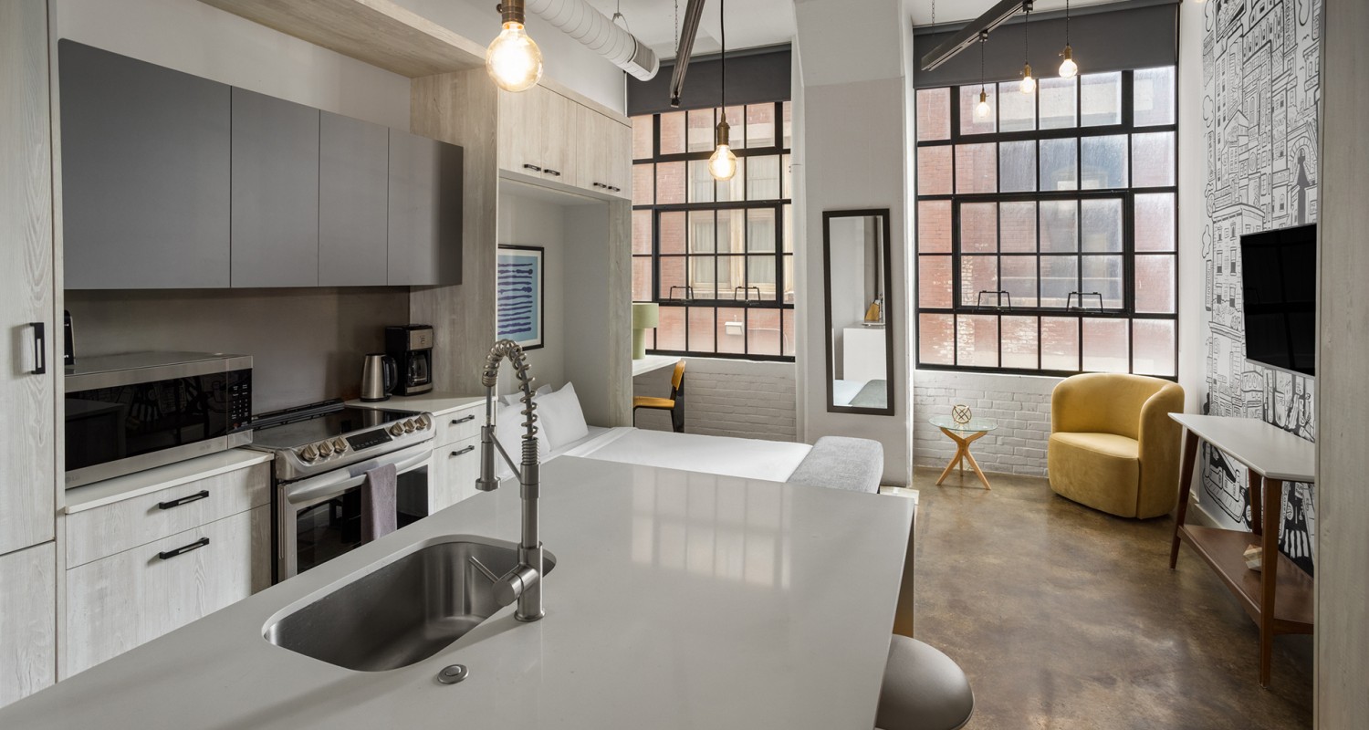 a kitchen with a sink and a large window