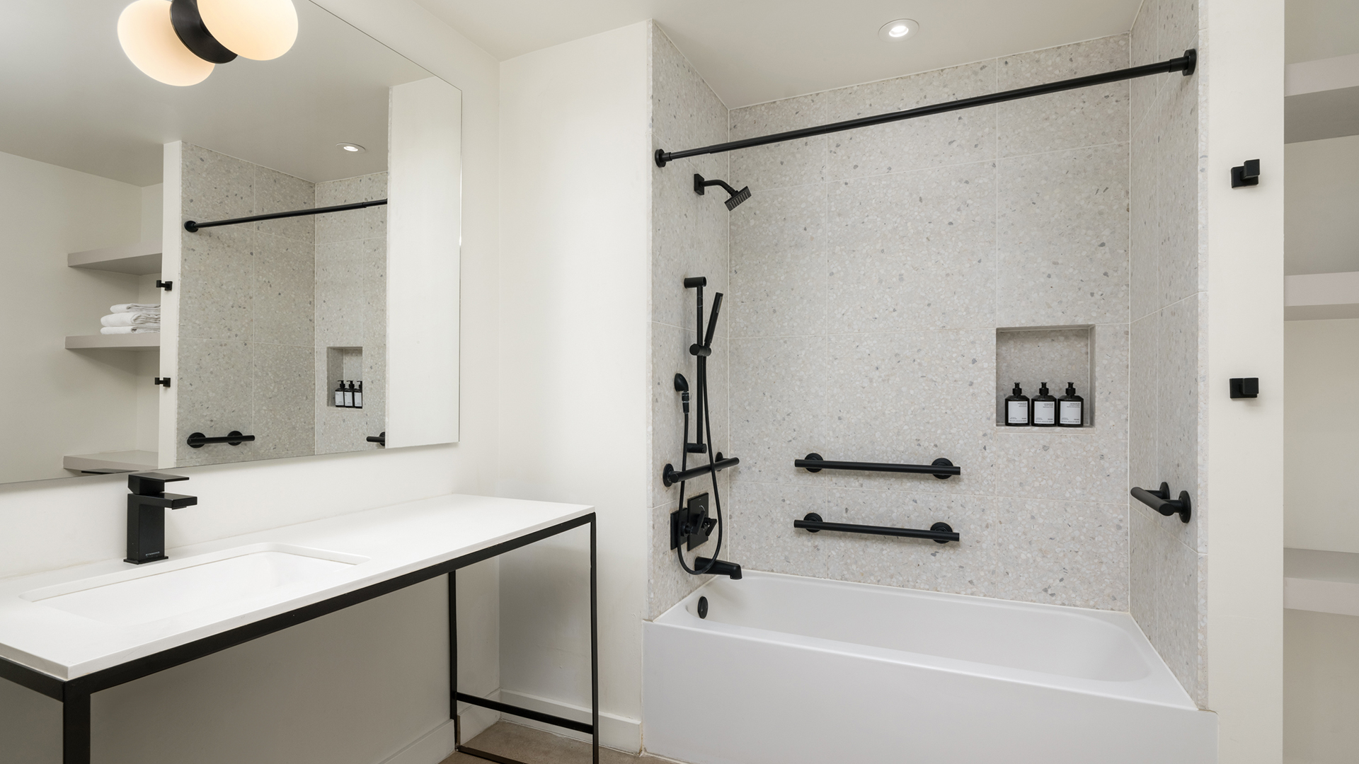 a bathroom with a bathtub and a sink