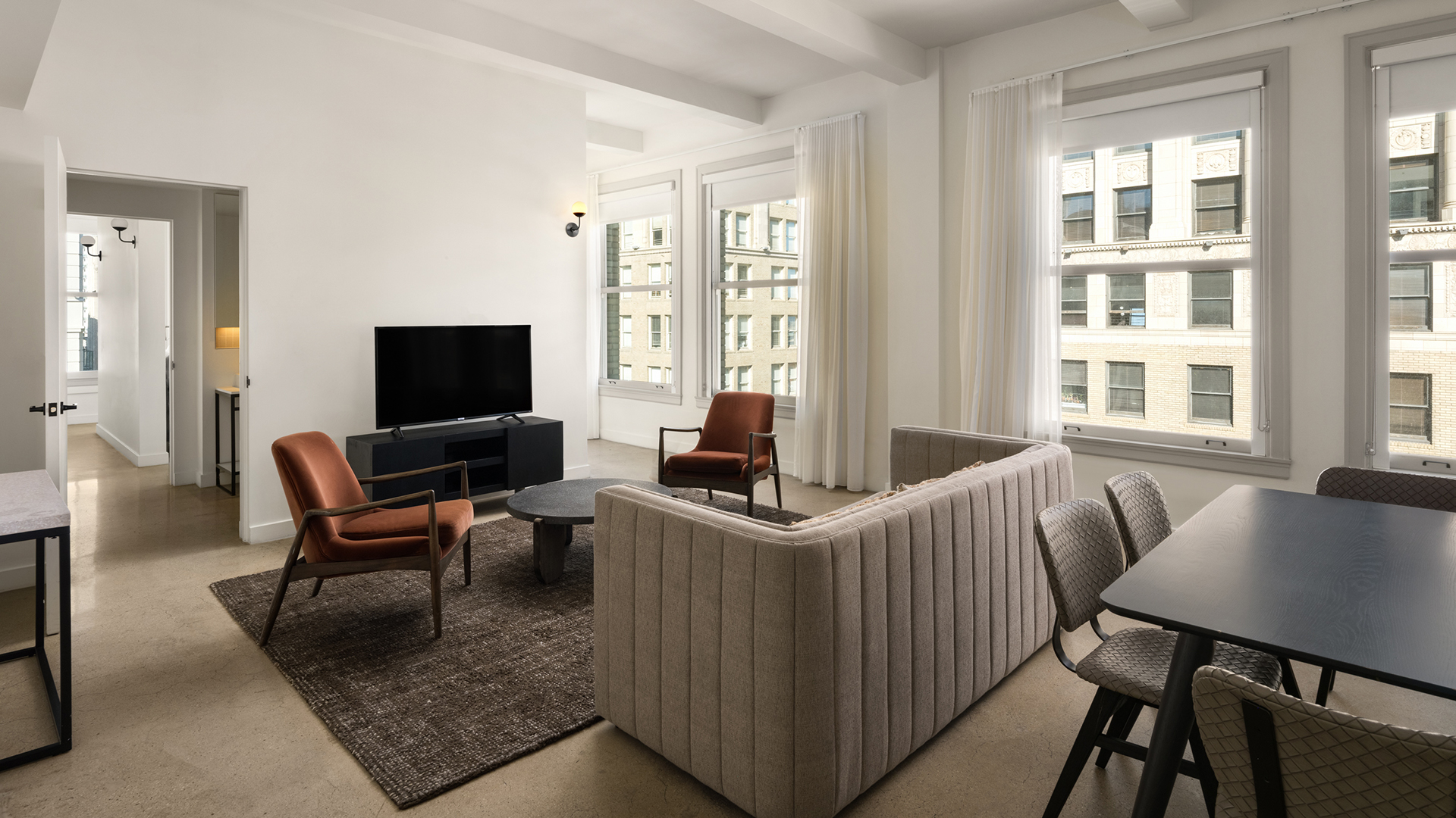 a living room with couches and a tv