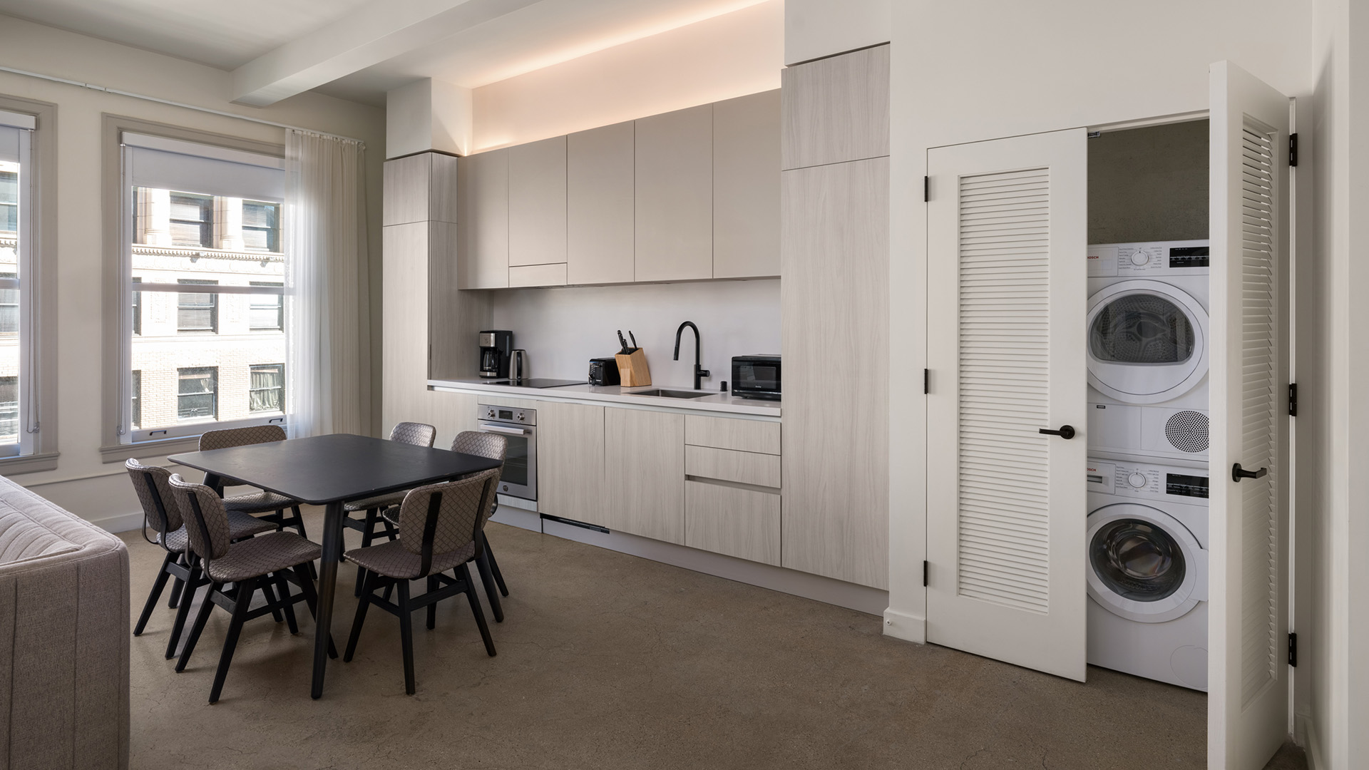 a kitchen with a table and chairs