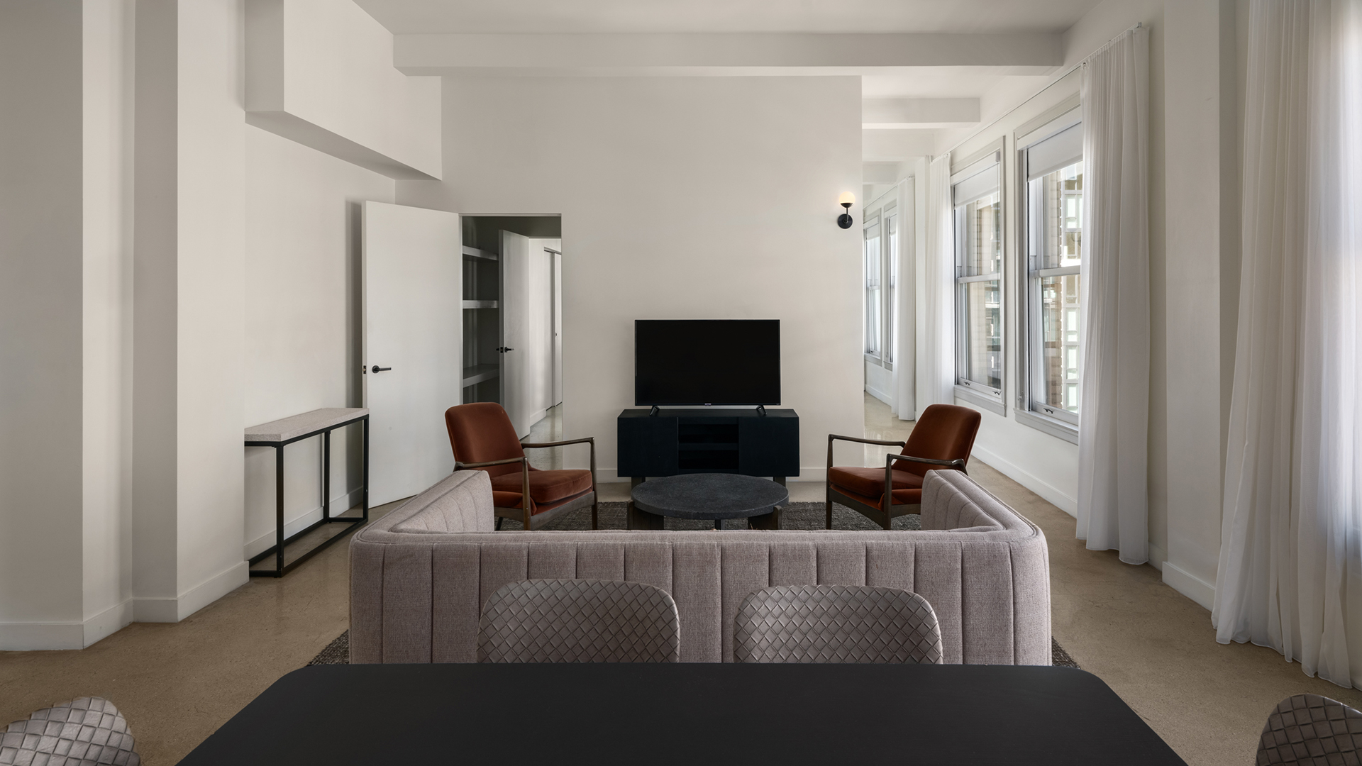 a room with a television and a couch