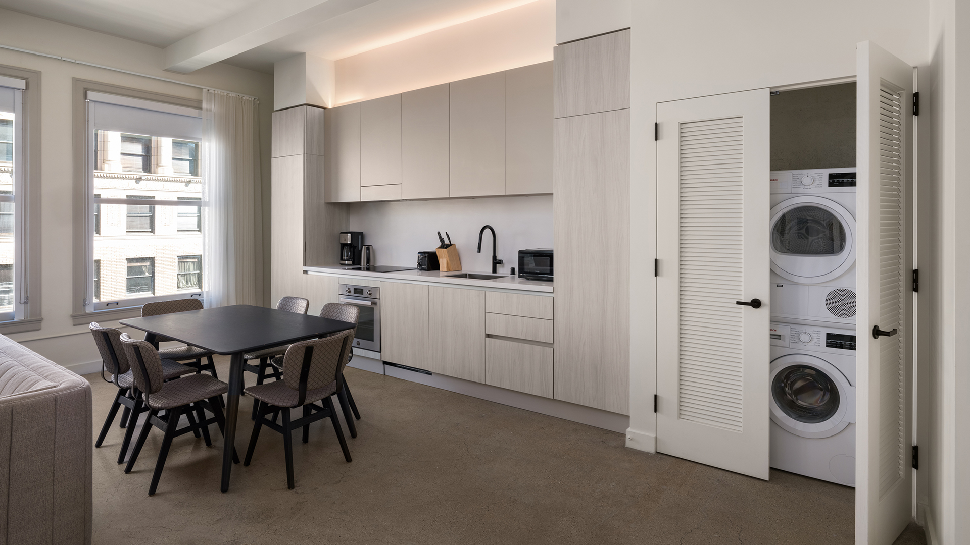 a kitchen with a table and chairs