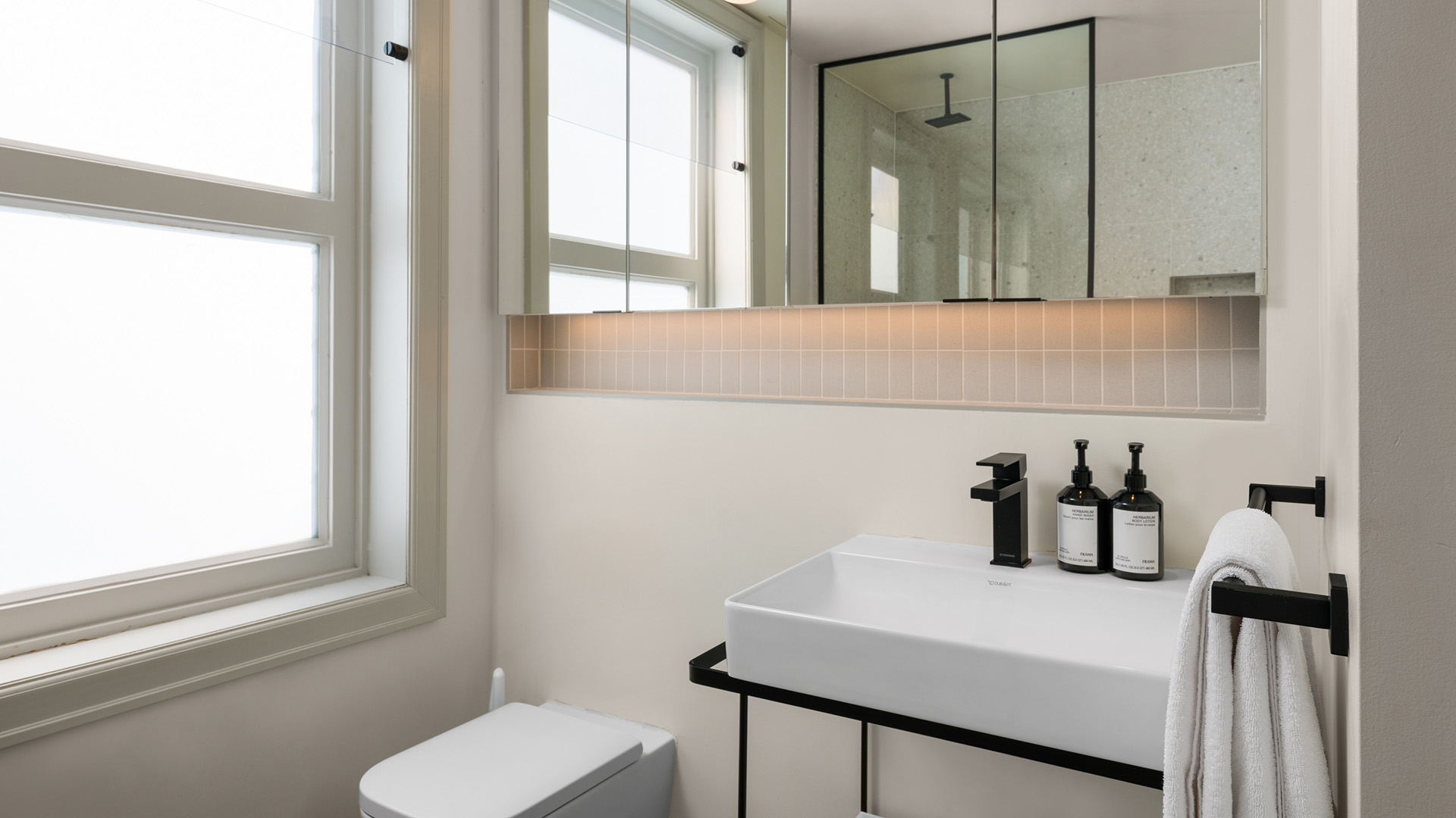a bathroom with a sink and toilet