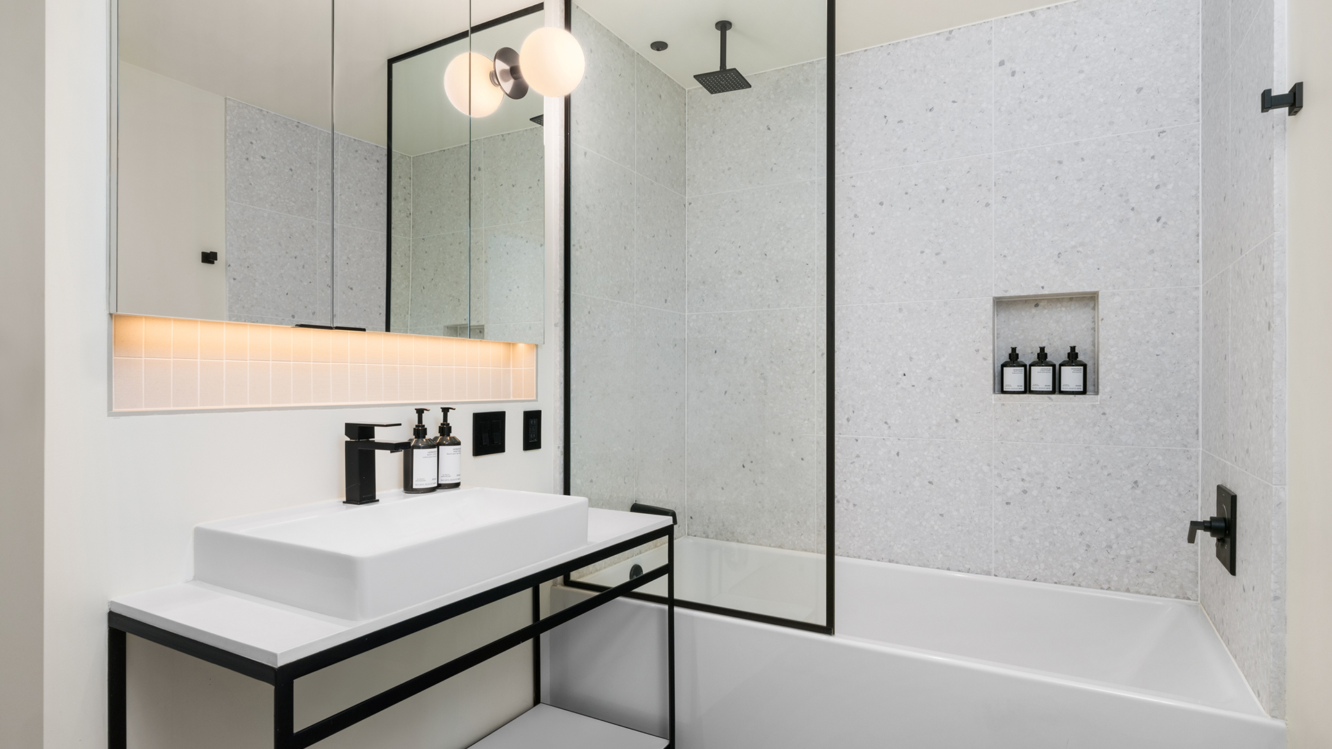 a bathroom with a shower and sink