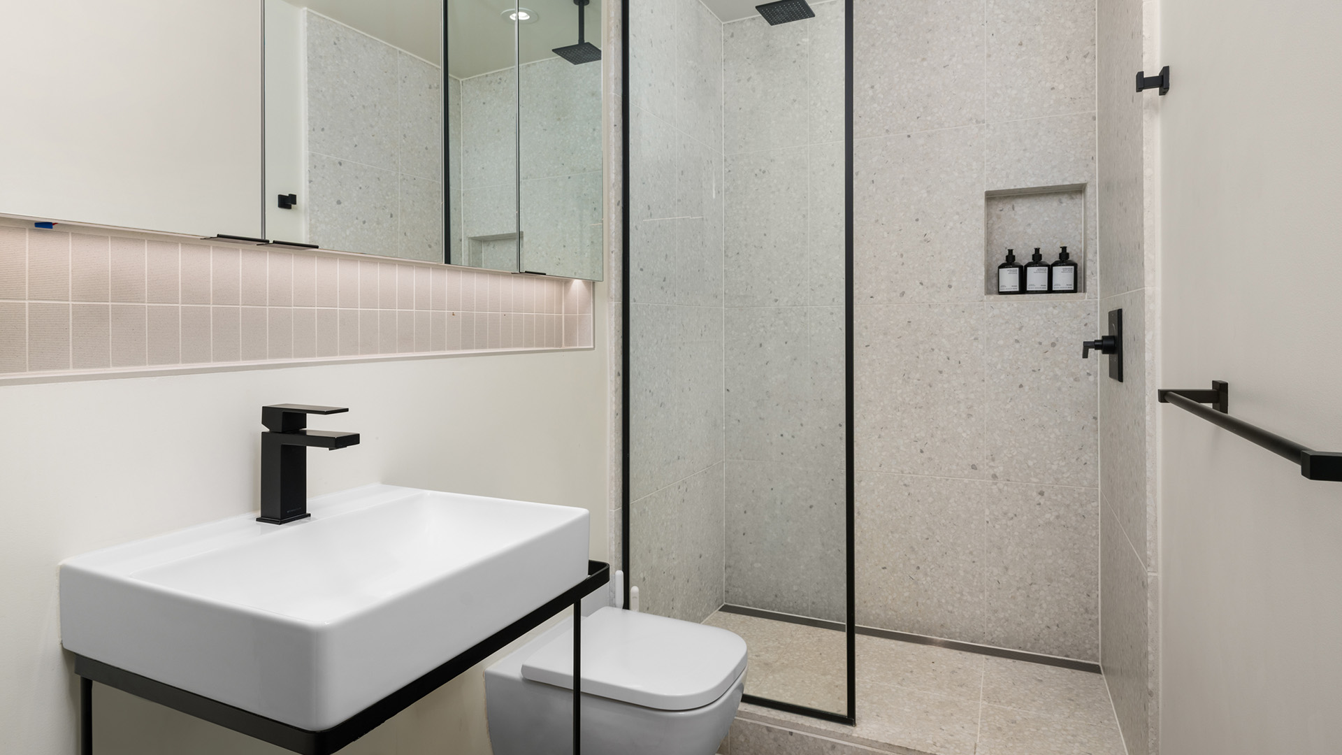a bathroom with a shower and sink