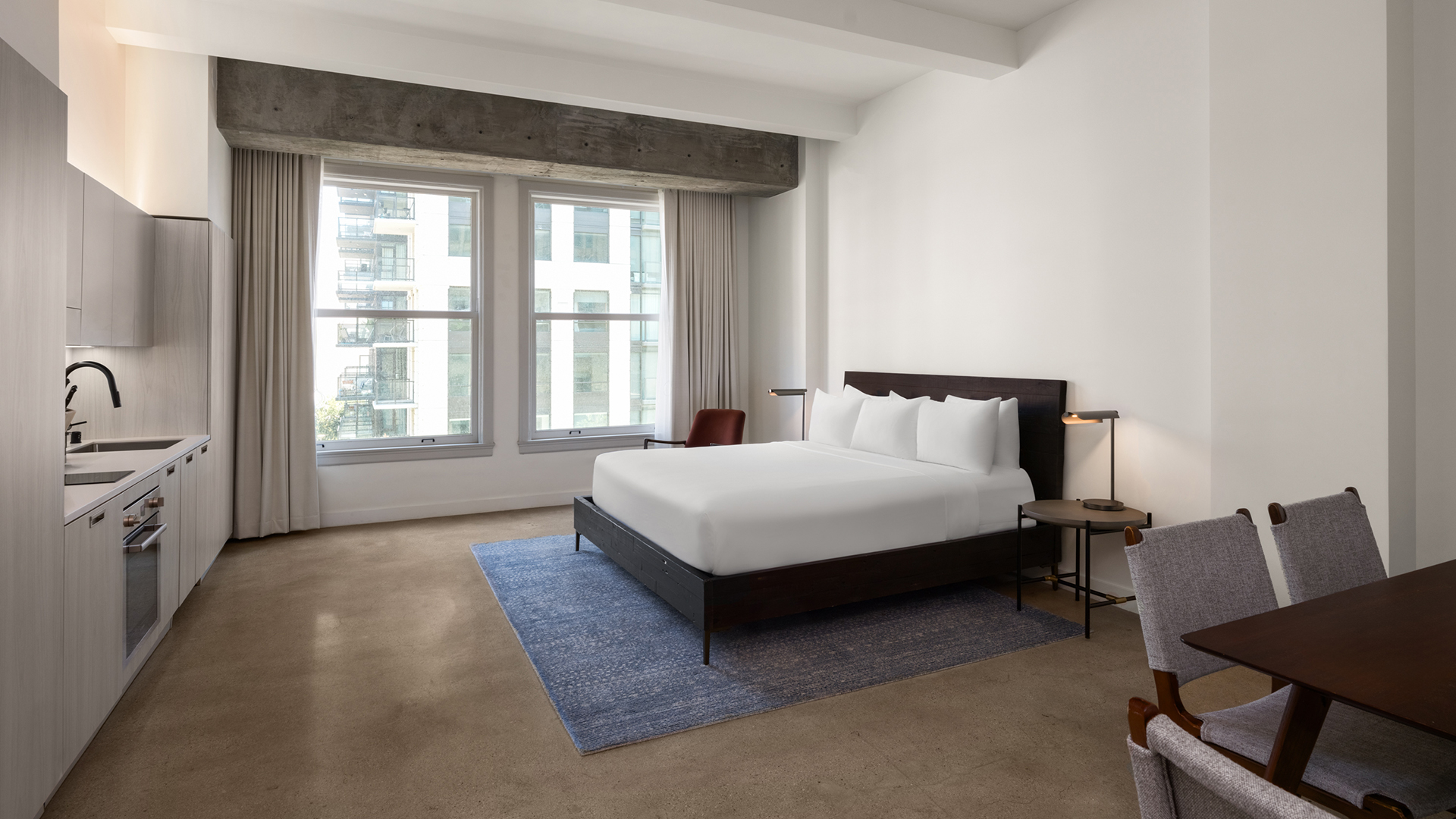 a bedroom with a bed and a chair