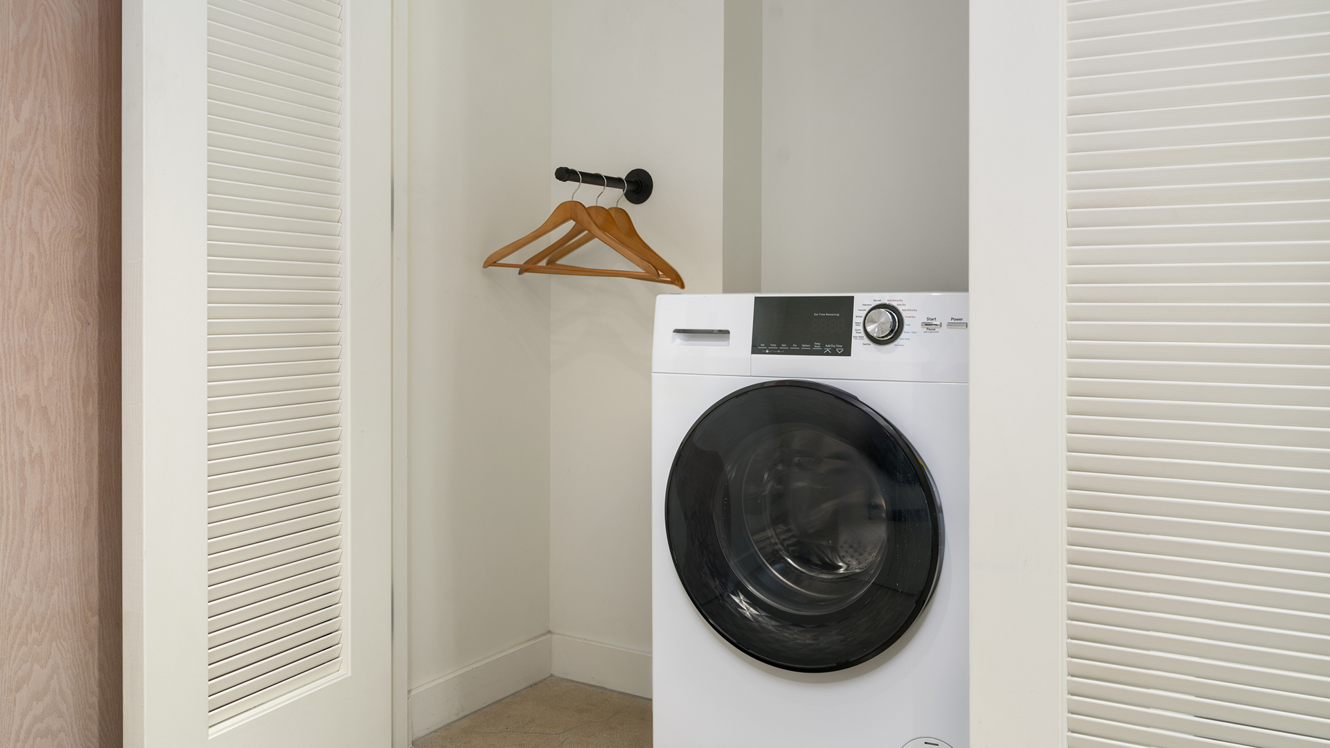 a white washing machine in a room