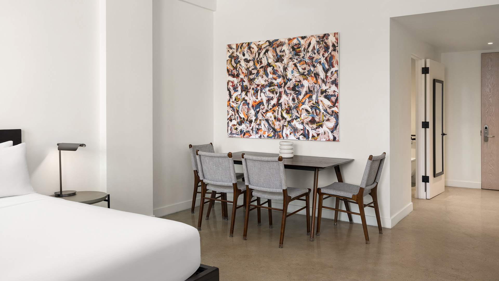a room with a table and chairs