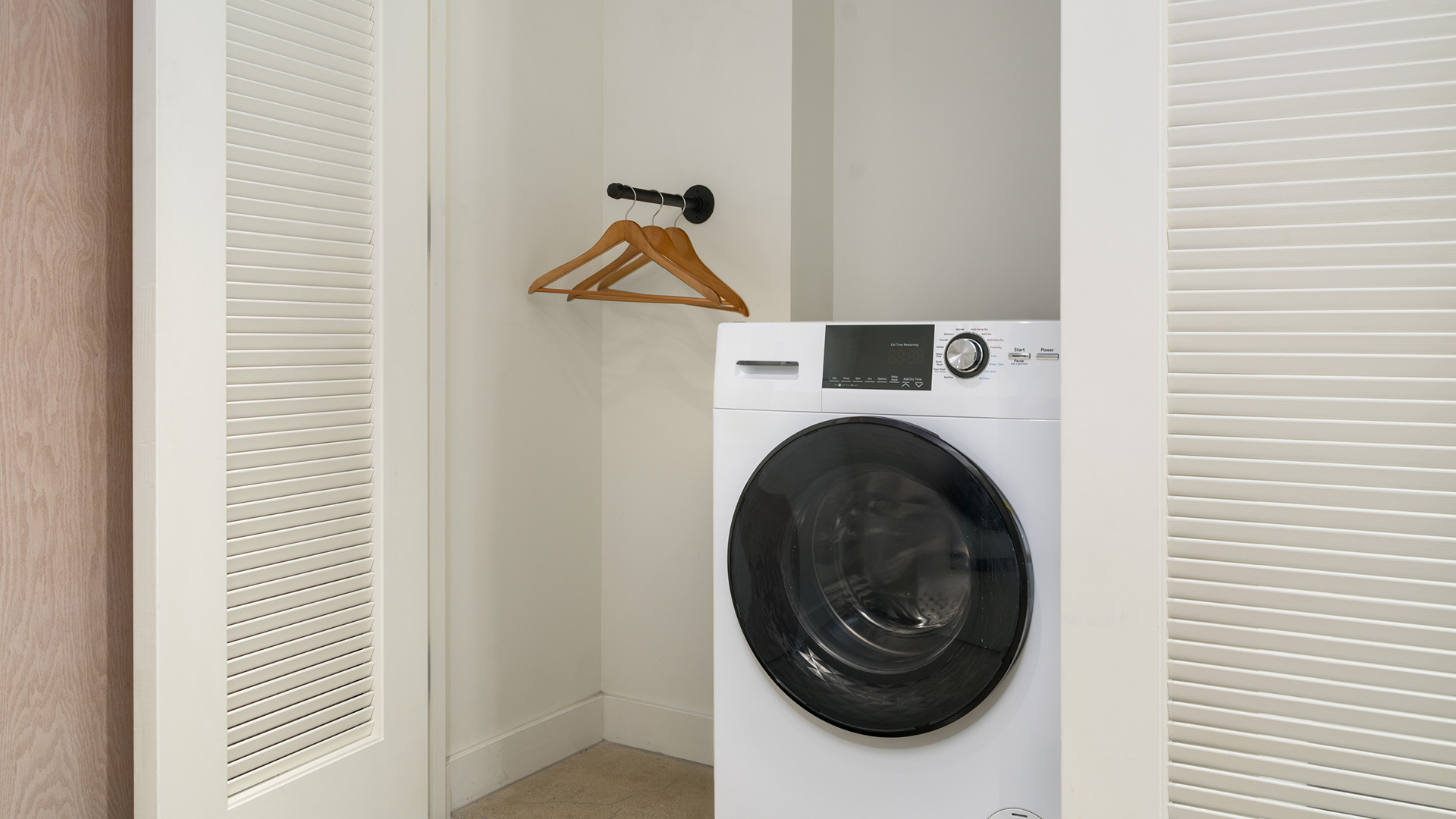 a white washing machine in a room