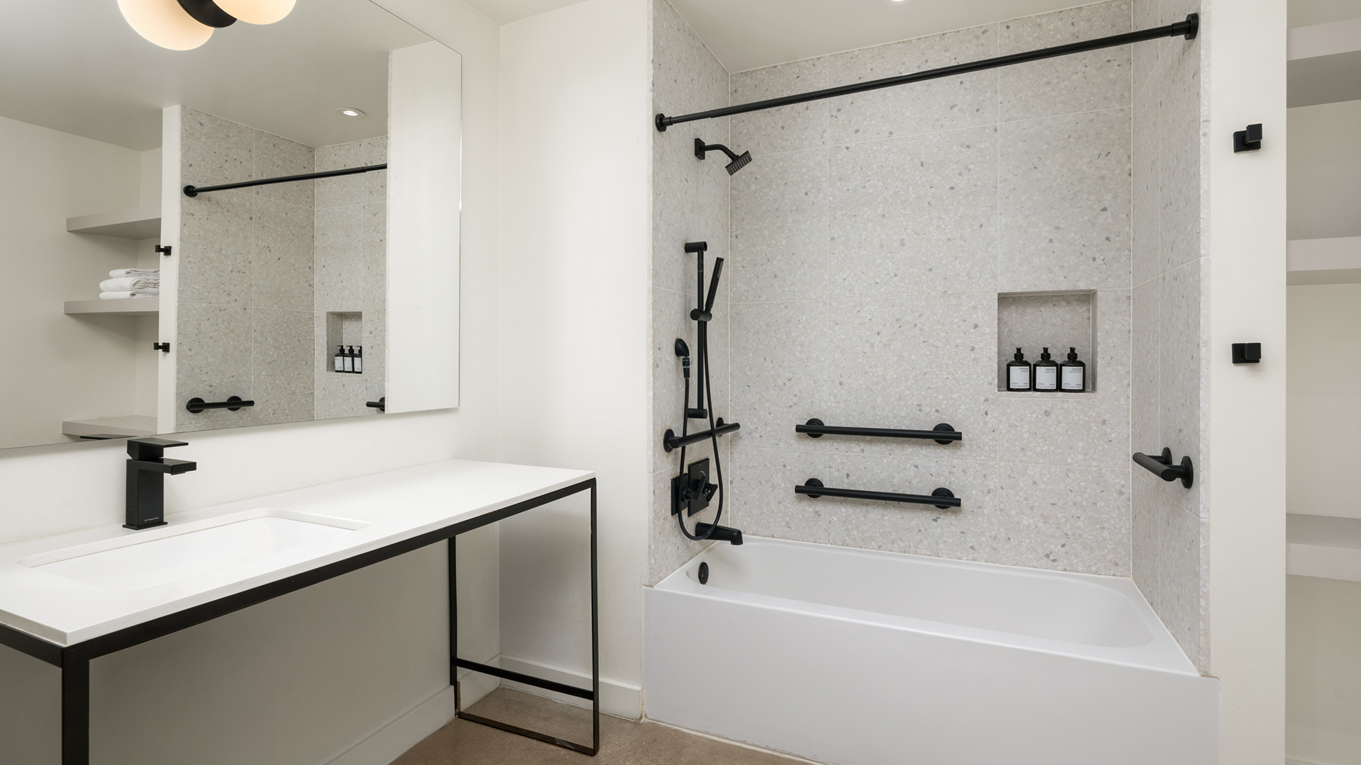 a bathroom with a bathtub and a sink
