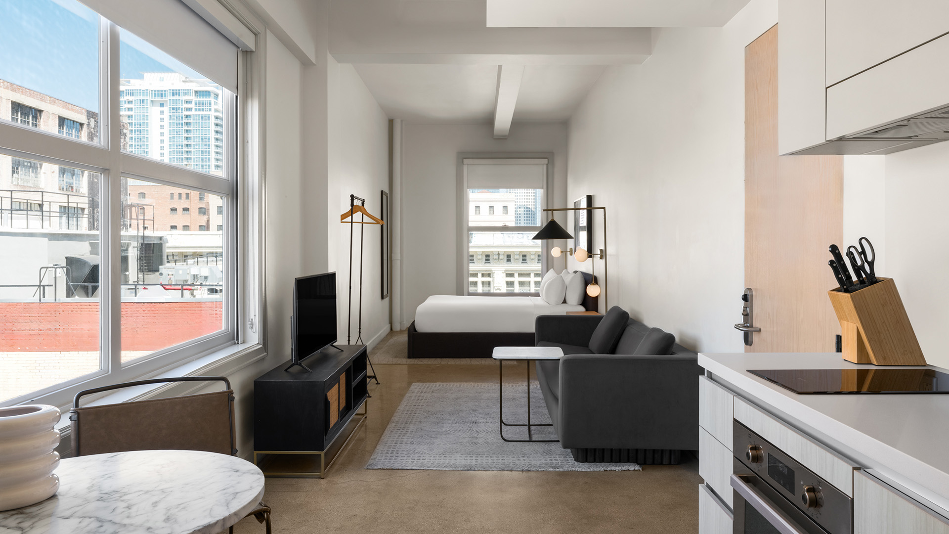 a room with a bed and a tv