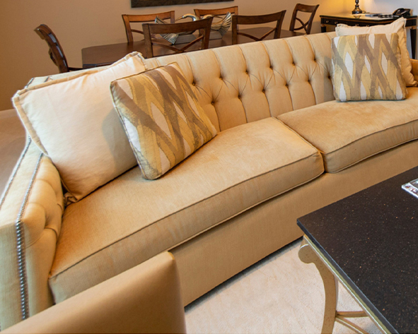 a couch with pillows in a living room