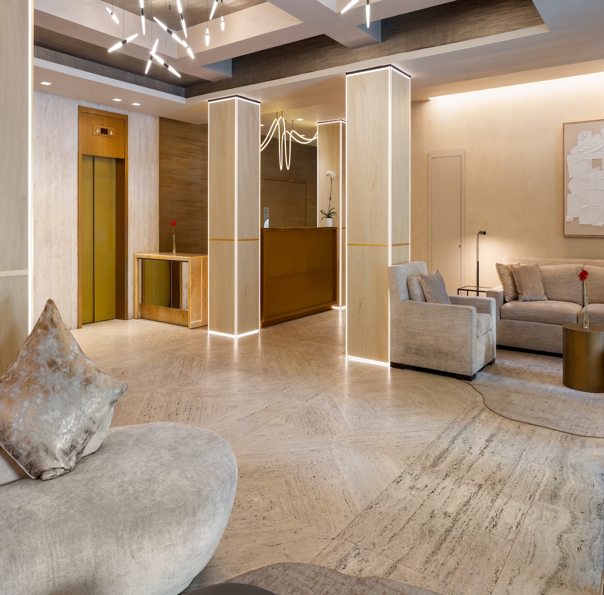 a lobby with a couch and chairs