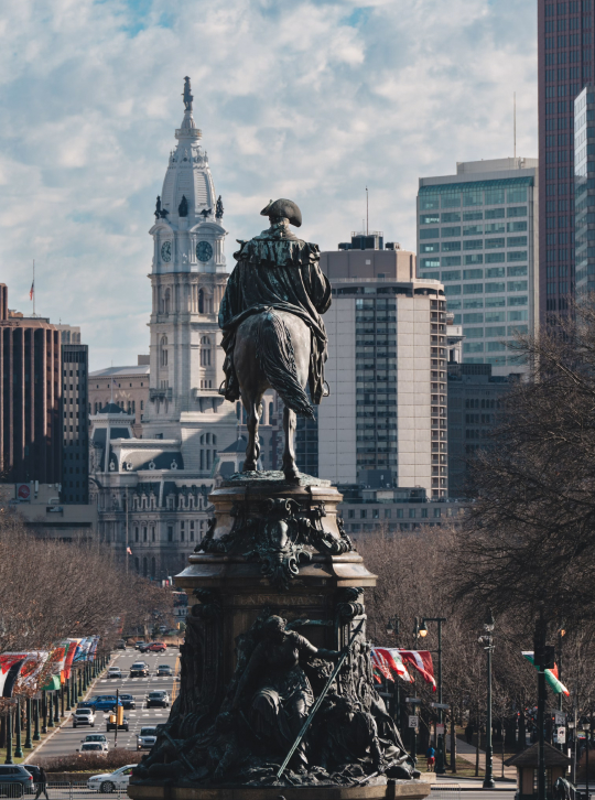 a statue of a man on a horse in a city