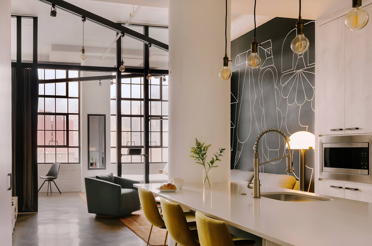 a kitchen with a table and chairs