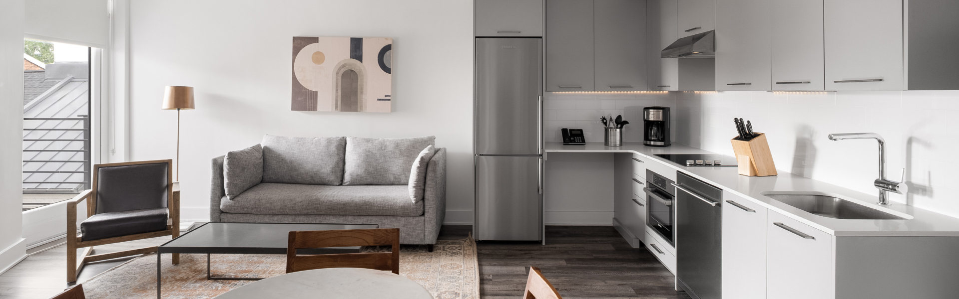 a living room with a couch and a refrigerator