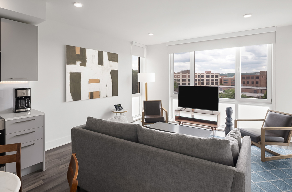 a living room with a couch and a tv