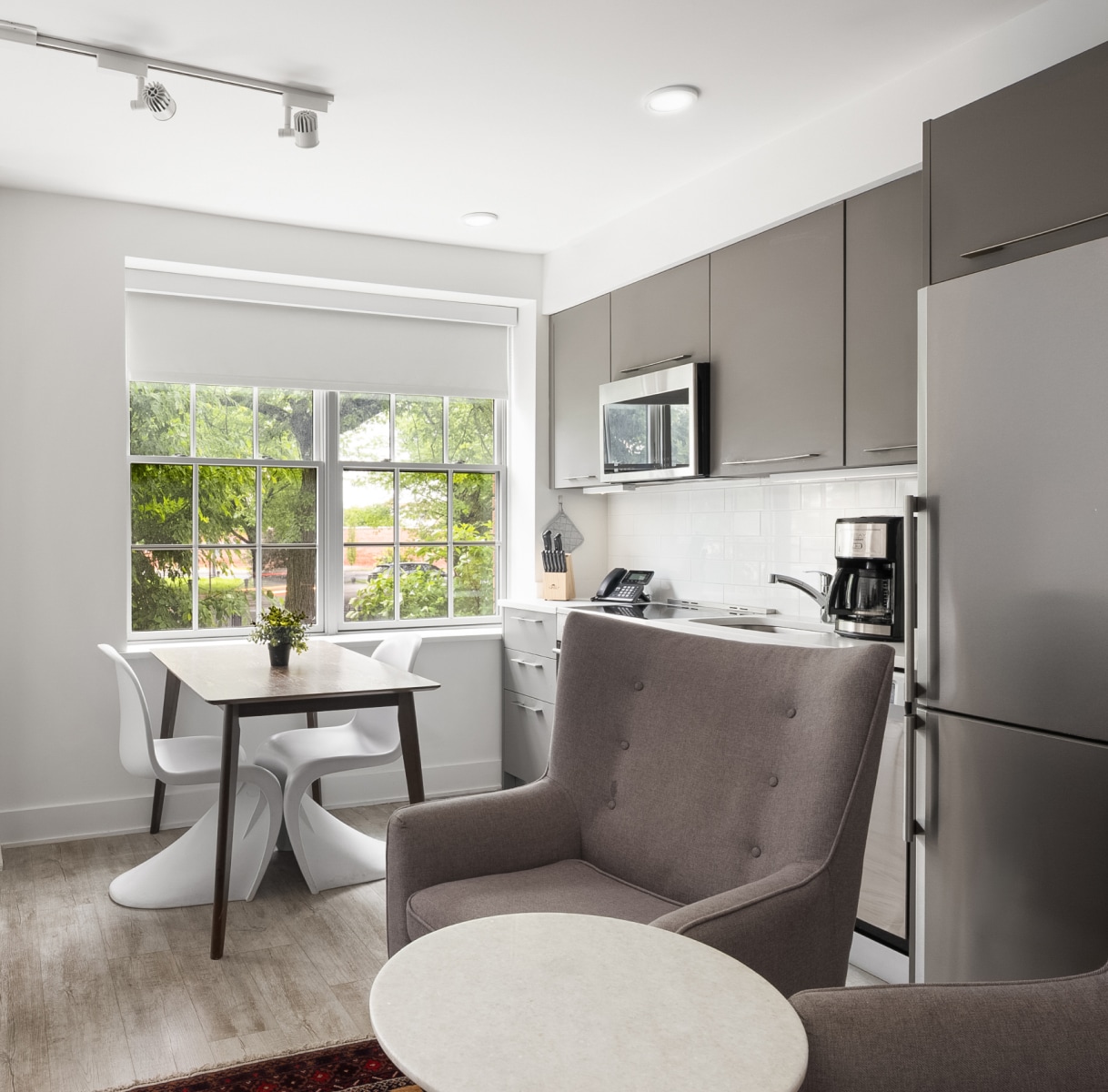 a kitchen with a table and chairs