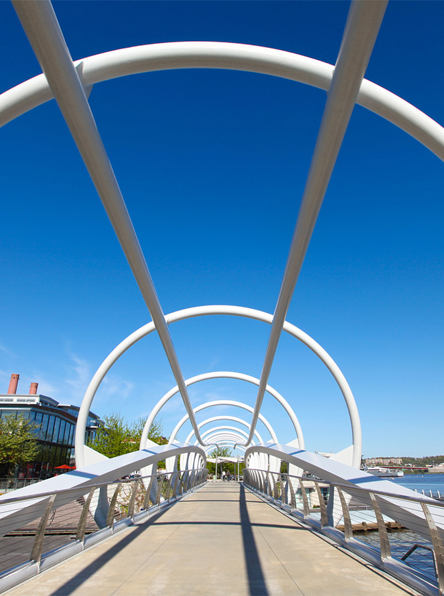 a white bridge with circular arches