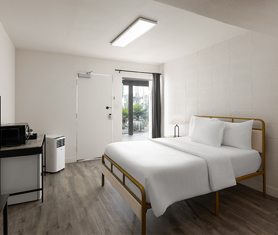a room with a bed and a door